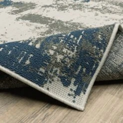 Trinity Modern Distressed Abstract Patio Area Rug Beige/Blue - Captiv8e Designs -Bedding Discounts GUEST 69bea875 354f 4e79 a476 91f7657dc401