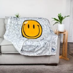 Commonwealth Toys OFFICIAL Smiley World Soft Throw Blanket | Cute Plush Blanket | 50 X 60 Inches